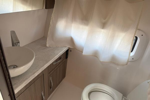 Head compartment with sink and toilet.