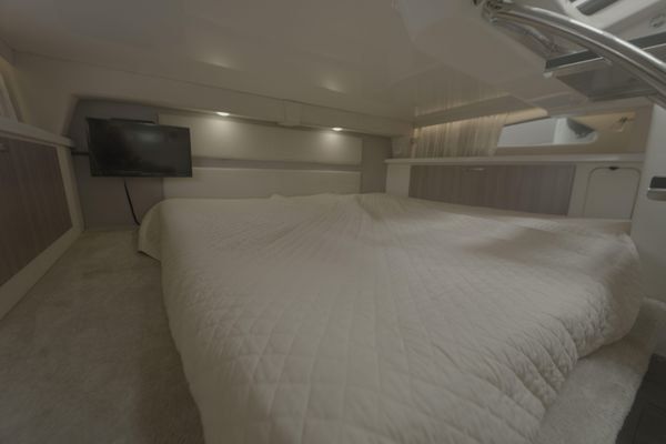 Interior cabin with V-berth and seating.