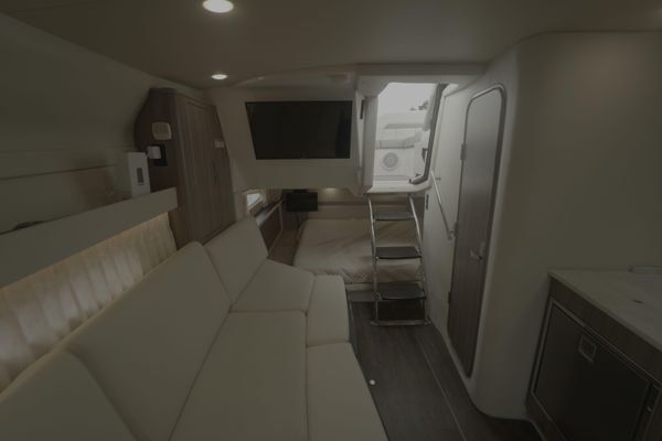 Compact galley with microwave and storage.