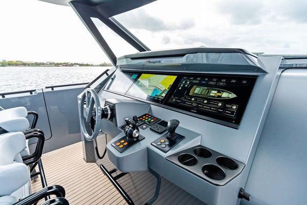 Outdoor galley with sink and refrigerators.