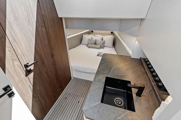Master stateroom with V-berth and ample lighting.