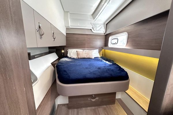 Master stateroom with desk and storage.