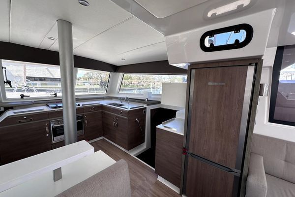 Owner's suite with lounge seating and storage.