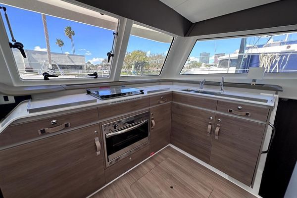 Port guest cabin with island berth and storage.