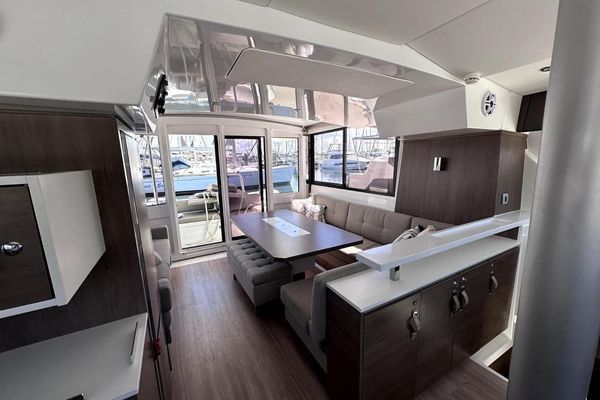 Galley showing integrated garbage bin and storage.