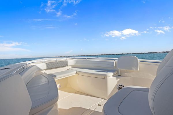 Helm station with dual Garmin displays and controls.