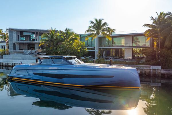 Aft sunbed and integrated teak swim platform