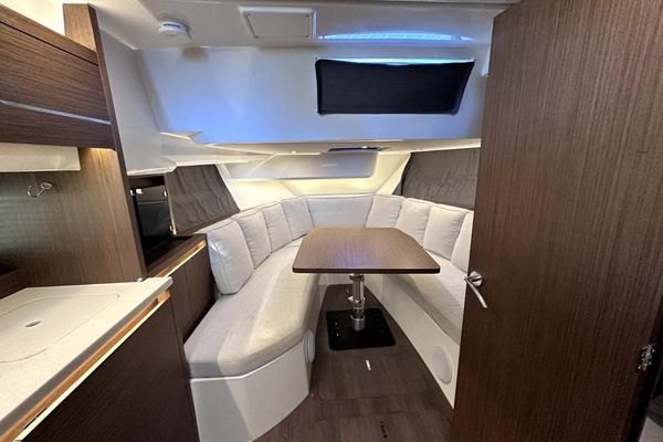 Modern galley with refrigerator and storage.