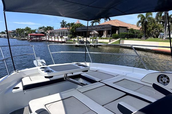 Triple Yamaha outboards at the transom.