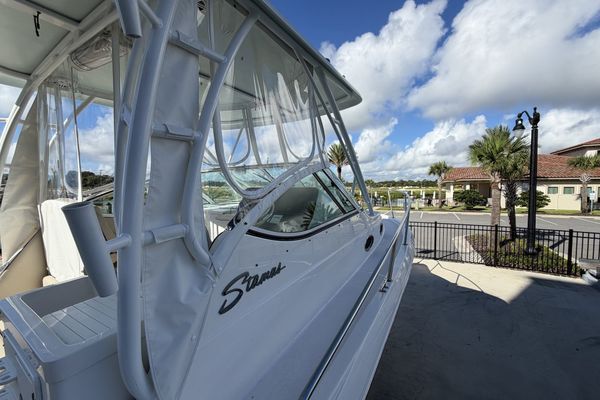 Aft view of the boat, featuring twin Suzuki outboards
