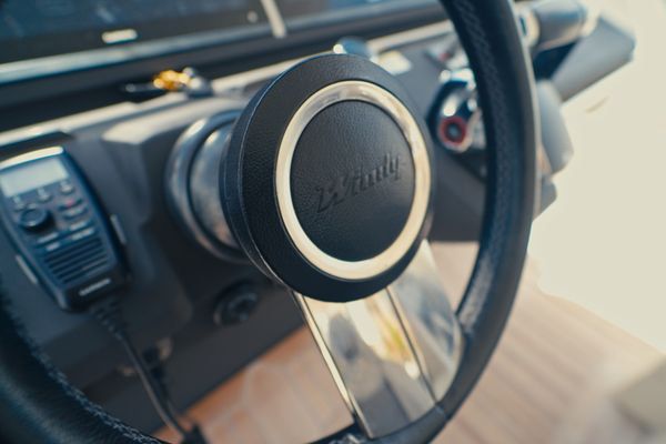 Modern helm station with Garmin electronics and joystick control.