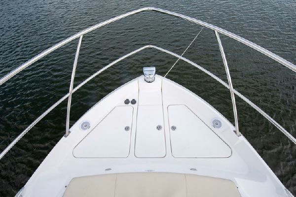 Spacious cockpit with L-shaped seating and table.