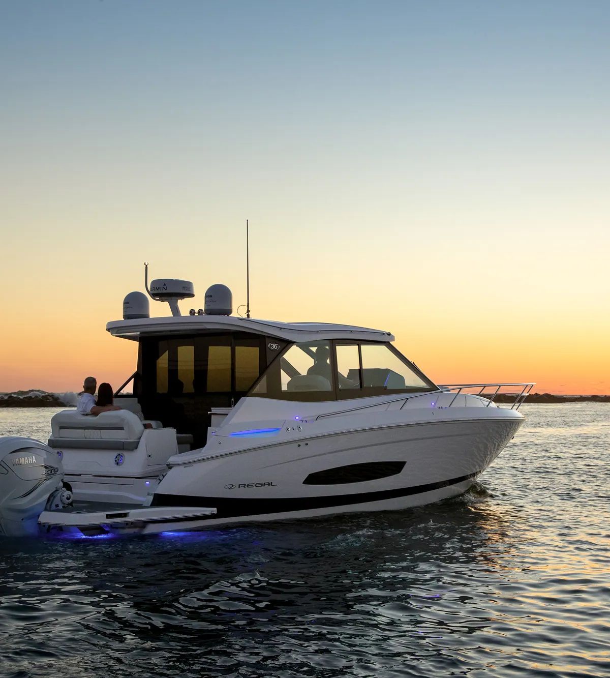 Regal 36 XO at anchor during a golden sunset