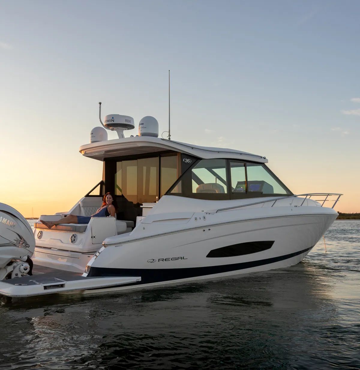 Regal 36 XO aft sunpad at sunset