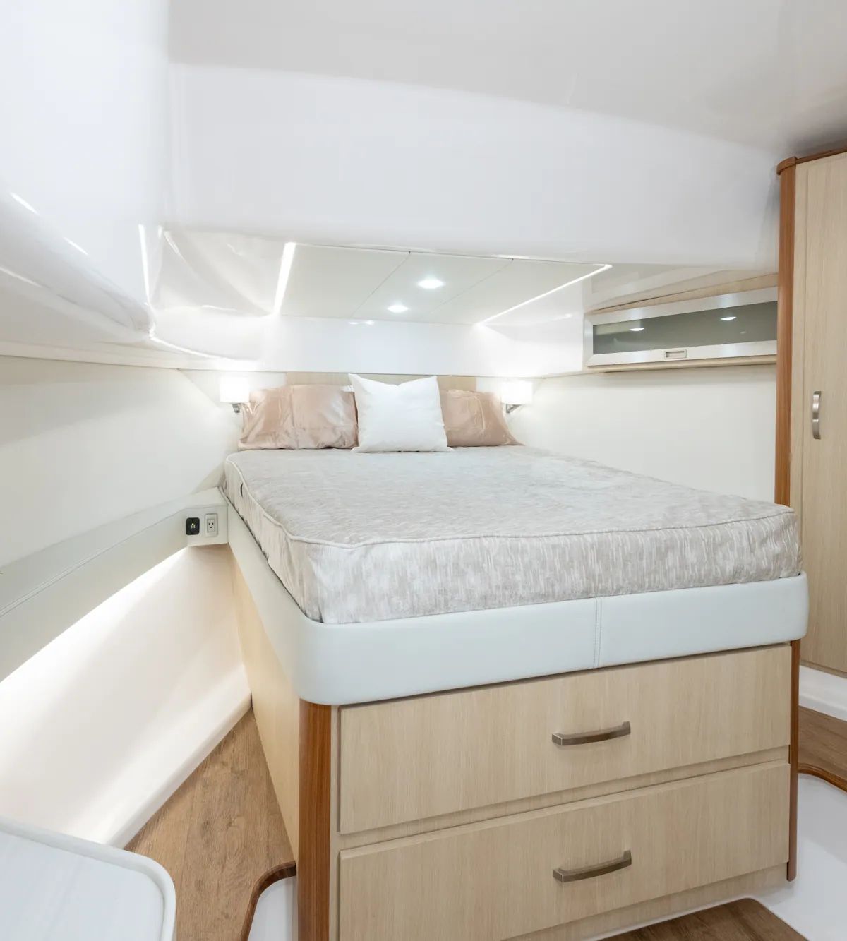 Regal 36 XO stateroom berth with light wood cabinetry