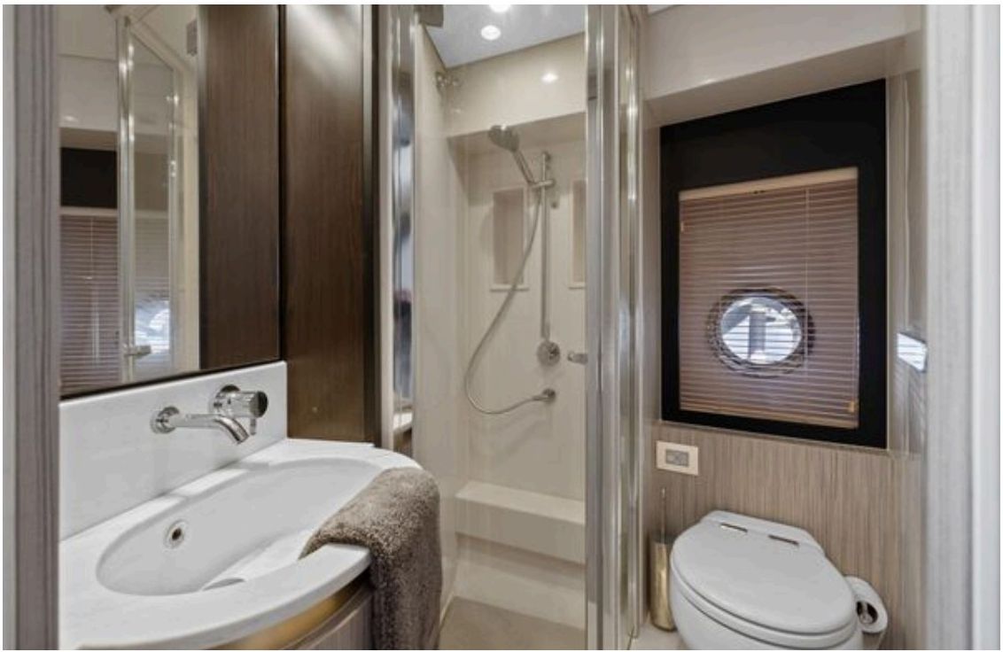Guest head with TECMA electric toilet and separate shower stall