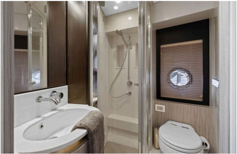 Guest head with TECMA electric toilet and separate shower stall