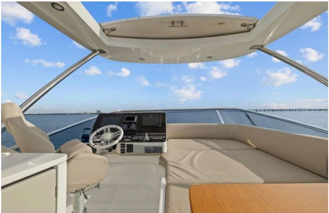 Flybridge helm with adjustable steering wheel and engine displays