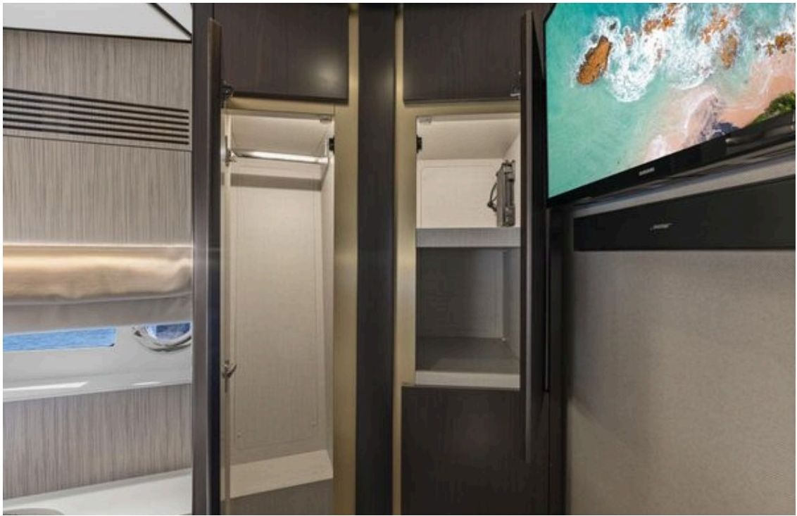 Owner's midship cabin with diagonal double bed and frame windows